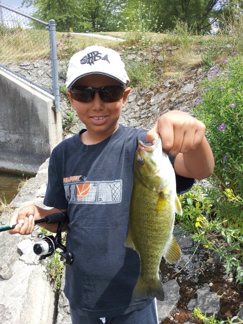 2012-07-27 13.37.37.jpg - Josh holding a Speed River Smallmouth from the Guelph area.